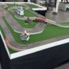 Digitale Slotcarbahn Event Aufbau mit Umrandung von SCX ähnlich Carrera